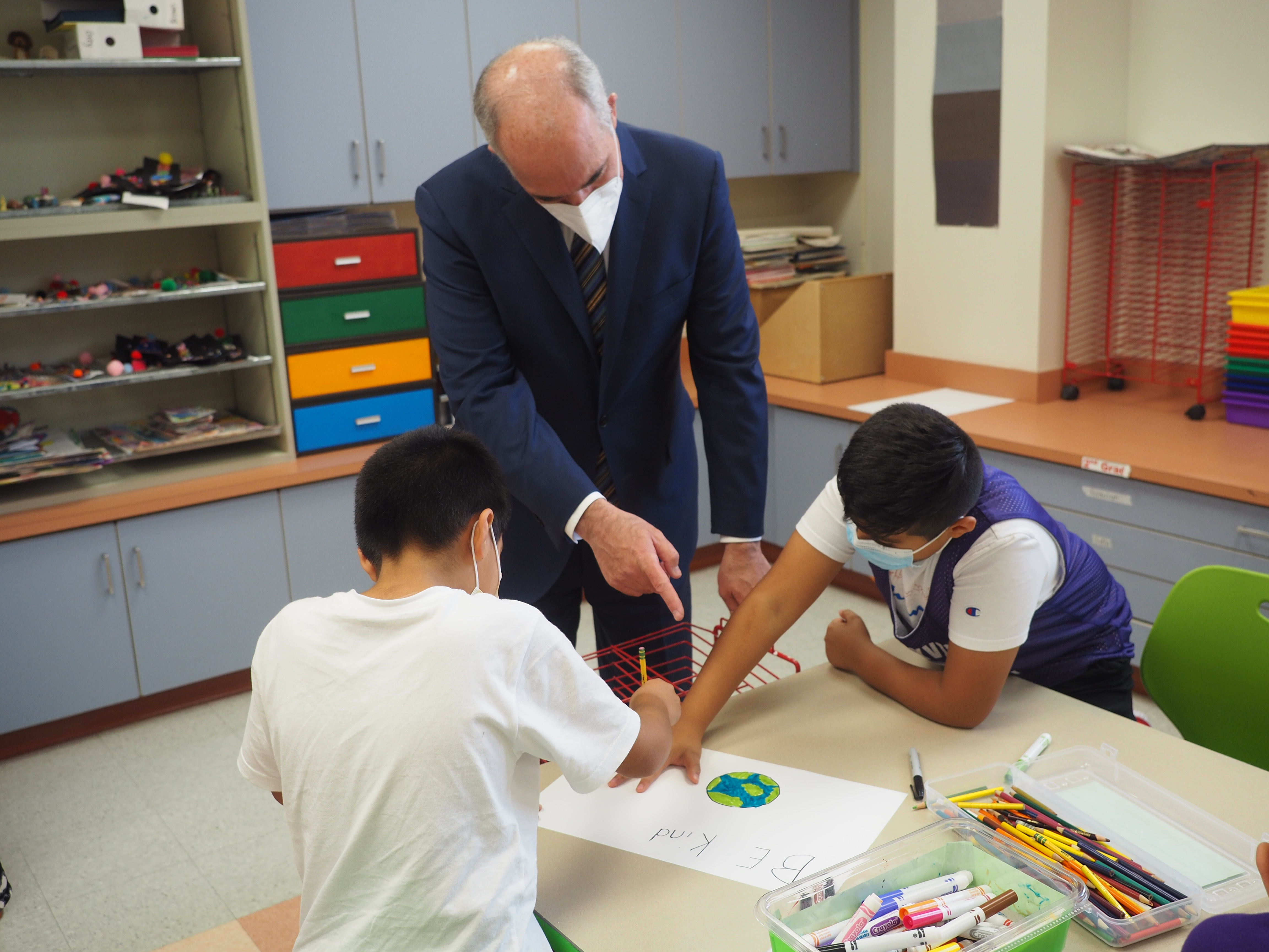 Sen. Casey looking at an art project done by elementary school students